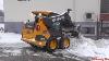 Volvo M70c Skid Steer Loader Clearing Piling Snow