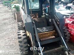 2003 New Holland skid steer high lift pour charger les camions-bennes