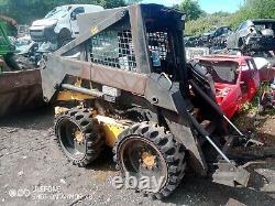 2003 New Holland skid steer high lift pour charger les camions-bennes